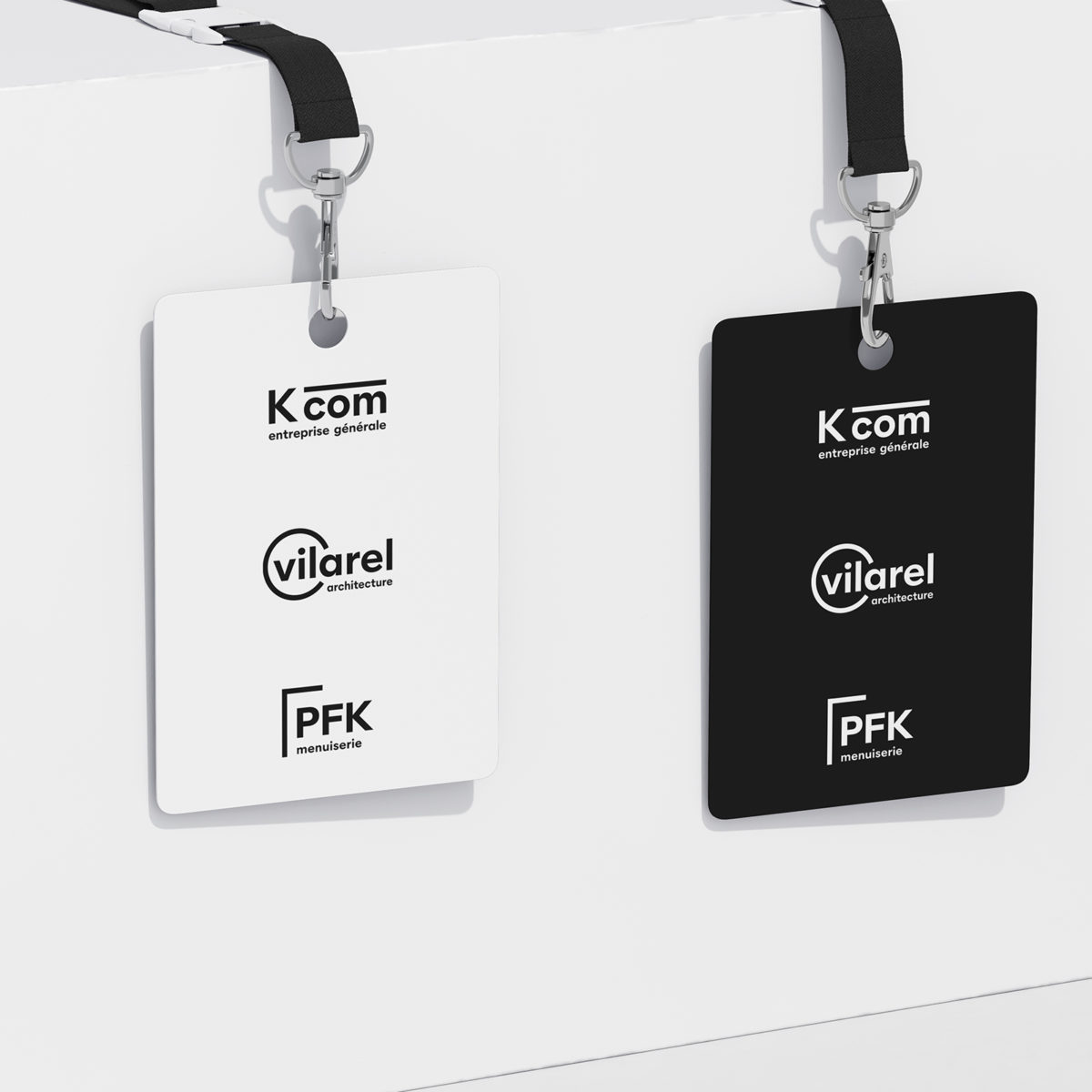 Logos K com, Vilarel et PFK sur un badge noir et blanc.